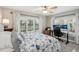 Bedroom with king bed, home office setup, and water views at 120 Tidy Island Blvd # 120, Bradenton, FL 34210