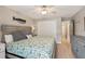 King-size bedroom with ceiling fan and built-in dresser at 120 Tidy Island Blvd # 120, Bradenton, FL 34210