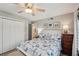 Bedroom with king bed, coastal decor, and water views at 120 Tidy Island Blvd # 120, Bradenton, FL 34210