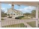 View of home from balcony, showcasing landscaping and driveway at 120 Tidy Island Blvd # 120, Bradenton, FL 34210