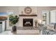 Living room fireplace with stone surround and wood mantel at 120 Tidy Island Blvd # 120, Bradenton, FL 34210