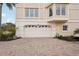 Exterior view of a spacious garage with a white door and brick driveway at 120 Tidy Island Blvd # 120, Bradenton, FL 34210