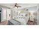 Spacious main bedroom with king-size bed and access to a bathroom at 120 Tidy Island Blvd # 120, Bradenton, FL 34210