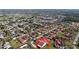 Aerial view of community highlighting landscaping, tile roofs, and community features at 1210 56Th W St # 1210, Bradenton, FL 34209