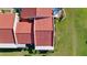 Aerial view of the red tiled roof highlighting green landscaping at 1210 56Th W St # 1210, Bradenton, FL 34209