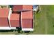 Aerial view of property showcasing the red tile roof and well-maintained landscaping at 1210 56Th W St # 1210, Bradenton, FL 34209