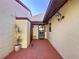 Charming front entrance with textured walls, a small stool, and a decorative glass door at 1210 56Th W St # 1210, Bradenton, FL 34209