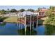 Scenic gazebo on stilts over the lake, offering a peaceful spot with waterfront views at 1210 56Th W St # 1210, Bradenton, FL 34209