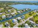 Wide aerial view of a canal-front community with lush vegetation at 130 Burns Rd, Terra Ceia, FL 34250