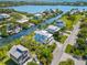 Waterfront property showcasing a house and neighborhood along a canal at 130 Burns Rd, Terra Ceia, FL 34250