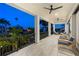 Spacious balcony with outdoor seating and water views at 130 Burns Rd, Terra Ceia, FL 34250