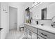 Modern bathroom with gray vanity and adjacent toilet at 130 Burns Rd, Terra Ceia, FL 34250