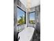 Relaxing bathtub with large window offering water views at 130 Burns Rd, Terra Ceia, FL 34250