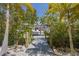 Private boat dock with access to the water, nestled amongst tropical vegetation at 130 Burns Rd, Terra Ceia, FL 34250