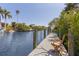 Private wooden dock with a comfortable chair, perfect for fishing at 130 Burns Rd, Terra Ceia, FL 34250