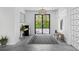 Minimalist entryway with a geometric rug and metal gate at 130 Burns Rd, Terra Ceia, FL 34250