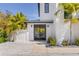 Modern entryway with a metal gate and a concrete floor at 130 Burns Rd, Terra Ceia, FL 34250