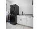 Convenient laundry room with stackable washer and dryer at 130 Burns Rd, Terra Ceia, FL 34250