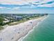 Aerial view of beach, coastline, and residential buildings at 1364 Berkshire Ct, Venice, FL 34292