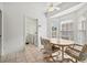 Breakfast nook with table and chairs, adjacent to kitchen and laundry at 1364 Berkshire Ct, Venice, FL 34292