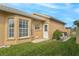 Exterior view of the home with manicured lawn at 1364 Berkshire Ct, Venice, FL 34292