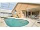 Refreshing kidney-shaped pool and patio area at 1364 Berkshire Ct, Venice, FL 34292