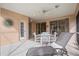 Relaxing screened patio with lounge chair and dining set at 1364 Berkshire Ct, Venice, FL 34292