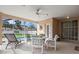 Relaxing screened patio with seating area overlooking the pool at 1364 Berkshire Ct, Venice, FL 34292