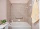 Clean bathroom with tub and shower at 1410 Maseno Dr, Venice, FL 34292