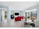 Bright dining area with white table and view of living room at 1410 Maseno Dr, Venice, FL 34292