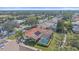 Aerial view of home with tile roof, screened-in pool, and lawn at 1426 Landview Ln, Osprey, FL 34229