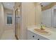 Bathroom featuring a glass shower and single sink at 1426 Landview Ln, Osprey, FL 34229