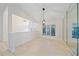 Bright dining room features tile floors, modern light fixture and abundant natural light from large windows at 1426 Landview Ln, Osprey, FL 34229