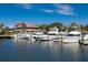 Scenic marina view with numerous boats, set against a backdrop of a stylish clubhouse at 1426 Landview Ln, Osprey, FL 34229