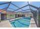 Enclosed pool area has brick deck, metal frame, and partial view of the home at 1426 Landview Ln, Osprey, FL 34229