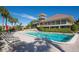 Resort-style community pool with lounge chairs and a clubhouse, perfect for relaxation and socializing at 1426 Landview Ln, Osprey, FL 34229