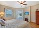 Main bedroom with private access to the pool and a large window at 146 Willow Bend Way, Osprey, FL 34229