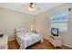 Bedroom with wood floors and a ceiling fan at 146 Willow Bend Way, Osprey, FL 34229