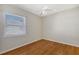 Simple bedroom with wood floors and a ceiling fan at 146 Willow Bend Way, Osprey, FL 34229