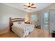 Relaxing bedroom with bamboo furniture and access to the pool area at 146 Willow Bend Way, Osprey, FL 34229