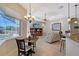 Casual breakfast nook with pool view and a wood table and chairs at 146 Willow Bend Way, Osprey, FL 34229