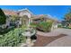 Exterior view of a house with a fountain and lush landscaping at 146 Willow Bend Way, Osprey, FL 34229