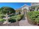 Front entryway with a stone path, fountain, and lush landscaping at 146 Willow Bend Way, Osprey, FL 34229