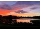 Community lake view showcasing a vibrant sunset at 146 Willow Bend Way, Osprey, FL 34229