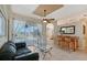 Living room with a view of the pool and a wet bar at 146 Willow Bend Way, Osprey, FL 34229