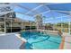 Inviting screened pool with spa and spacious deck at 146 Willow Bend Way, Osprey, FL 34229