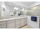 Modern bathroom with double vanity, stylish fixtures, and a glass-enclosed shower at 15326 Castle Park Ter, Lakewood Ranch, FL 34202