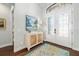 A spacious foyer features decorative double doors with sidelights and hardwood floors at 15326 Castle Park Ter, Lakewood Ranch, FL 34202