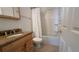 Bathroom with granite countertop vanity and shower/tub combo at 1535 Nursery Rd # 107, Clearwater, FL 33756