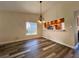 Dining room with kitchen pass-through and chandelier at 1535 Nursery Rd # 107, Clearwater, FL 33756